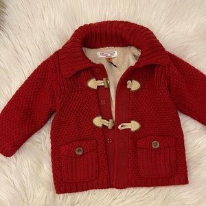 Red baby coat with lining on the inside